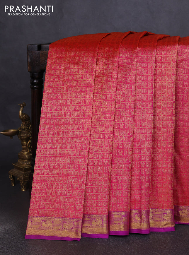 Pure kanchipuram silk saree dual shade of pinkish orange and purple with allover zari woven brocade weaves and zari woven border