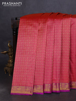 Pure kanchipuram silk saree dual shade of pinkish orange and purple with allover zari woven brocade weaves and zari woven border