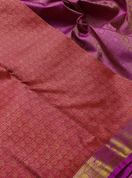 Pure kanchipuram silk saree dual shade of pinkish orange and purple with allover zari woven brocade weaves and zari woven border