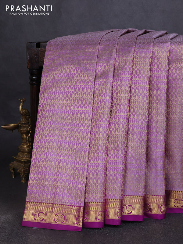 Pure kanchipuram silk saree pastel purple and purple with allover zari woven brocade weaves and zari woven border