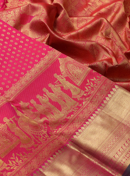 Pure kanchipuram silk saree dual shade of pinkish orange and green with allover zari woven butta weaves and long wedding design zari woven border