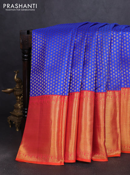 Pure kanchipuram silk saree royal blue and dual shade of pinkish orange with allover zari woven butta weaves and long rich zari woven border