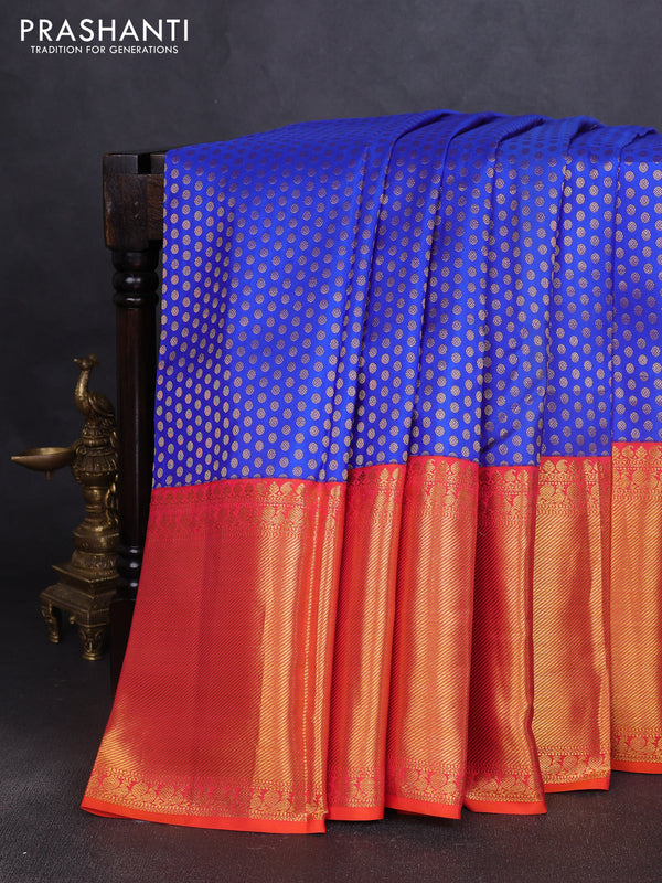 Pure kanchipuram silk saree royal blue and dual shade of pinkish orange with allover zari woven butta weaves and long rich zari woven border