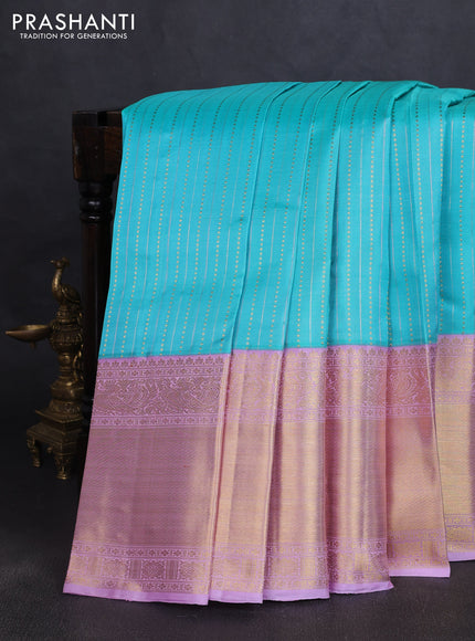 Pure kanchipuram silk saree teal blue and mild lavender with allover silver & gold zari woven buttas and long rich zari woven korvai border