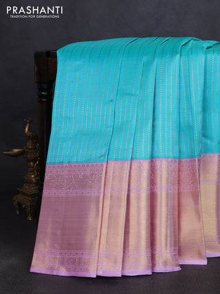 Pure kanchipuram silk saree teal blue and mild lavender with allover silver & gold zari woven buttas and long rich zari woven korvai border