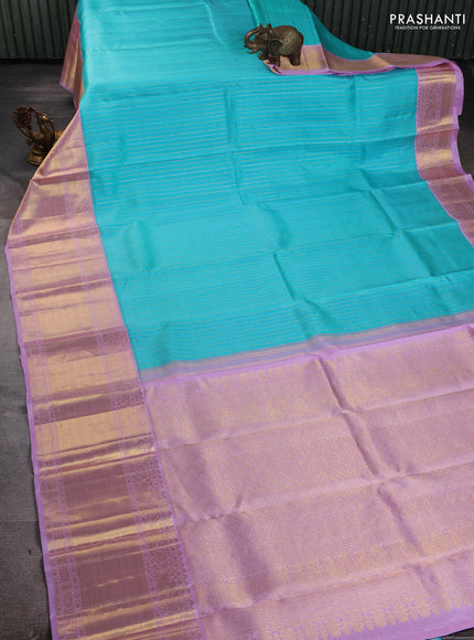 Pure kanchipuram silk saree teal blue and mild lavender with allover silver & gold zari woven buttas and long rich zari woven korvai border