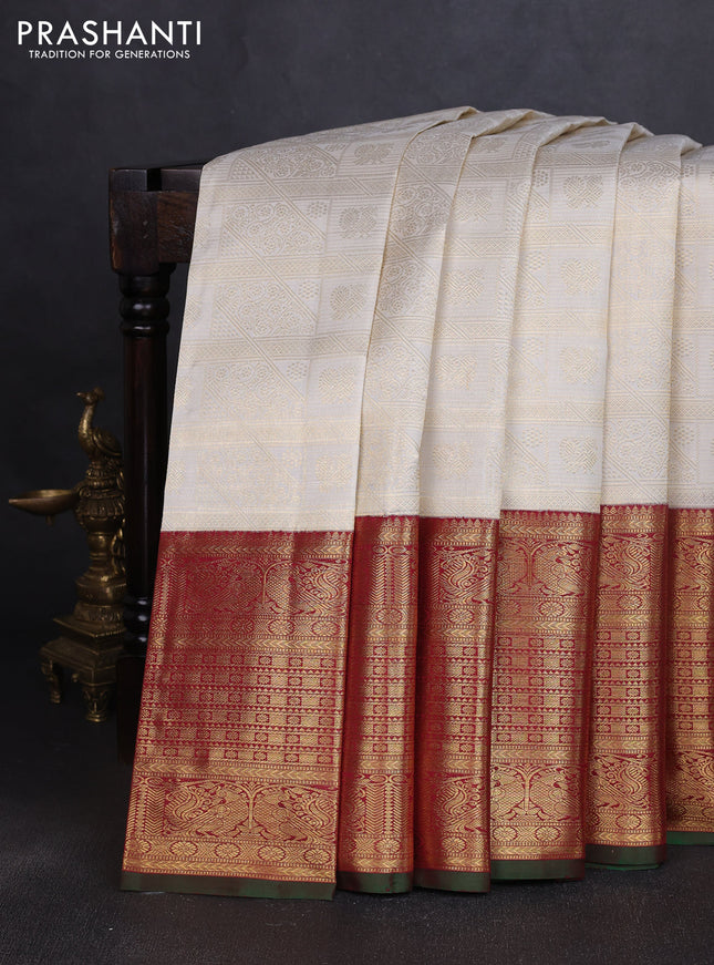 Pure kanchipuram silk saree off white and maroon with allover zari woven brocade weaves and long rich annam zari woven border