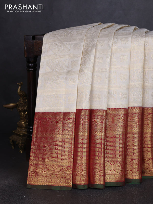 Pure kanchipuram silk saree off white and maroon with allover zari woven brocade weaves and long rich annam zari woven border