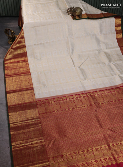 Pure kanchipuram silk saree off white and maroon with allover zari woven brocade weaves and long rich annam zari woven border