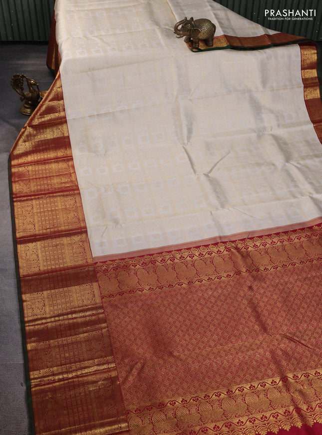 Pure kanchipuram silk saree off white and maroon with allover zari woven brocade weaves and long rich annam zari woven border