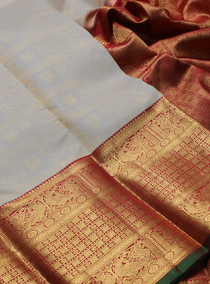 Pure kanchipuram silk saree off white and maroon with allover zari woven brocade weaves and long rich annam zari woven border