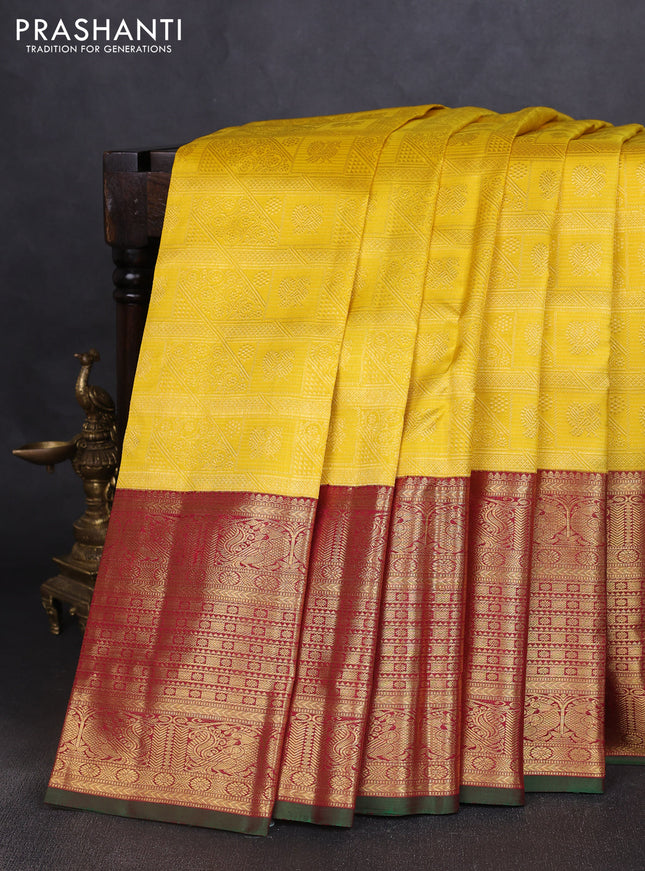 Pure kanchipuram silk saree yellow and maroon with allover zari woven brocade weaves and long rich annam zari woven border