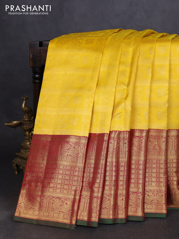Pure kanchipuram silk saree yellow and maroon with allover zari woven brocade weaves and long rich annam zari woven border