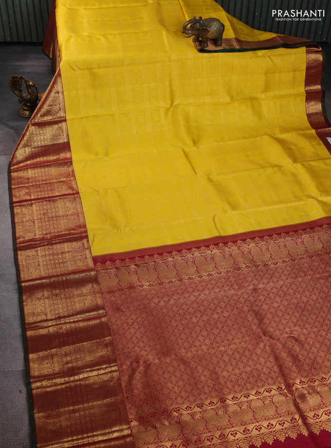 Pure kanchipuram silk saree yellow and maroon with allover zari woven brocade weaves and long rich annam zari woven border