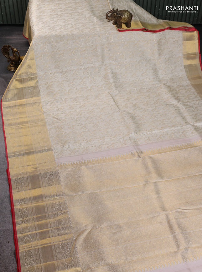 Pure kanchipuram silk saree cream and red with allover zari woven brocade weaves and long zari woven border