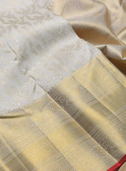 Pure kanchipuram silk saree cream and red with allover zari woven brocade weaves and long zari woven border
