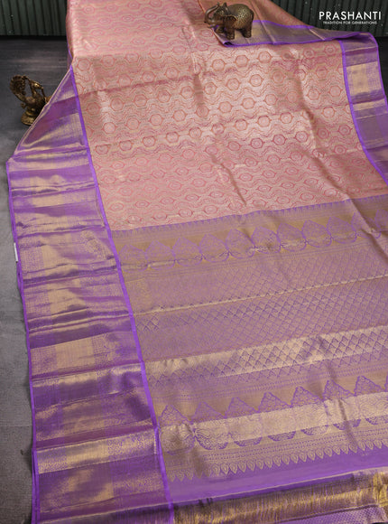 Pure kanchipuram tissue silk saree pastel peach and lavender with allover zari woven brocade weaves and long rich zari woven border