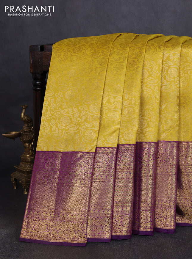 Pure kanchipuram silk saree mustard yellow and purple with allover zari woven brocade weaves and long zari woven border