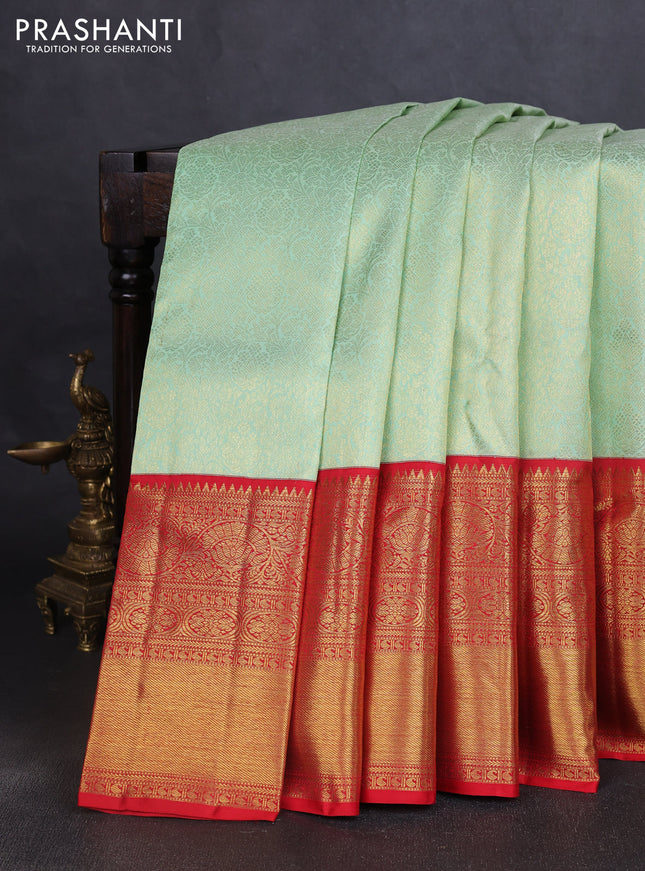 Pure kanchipuram silk saree pastel green and red with allover zari woven brocade weaves and long zari woven border