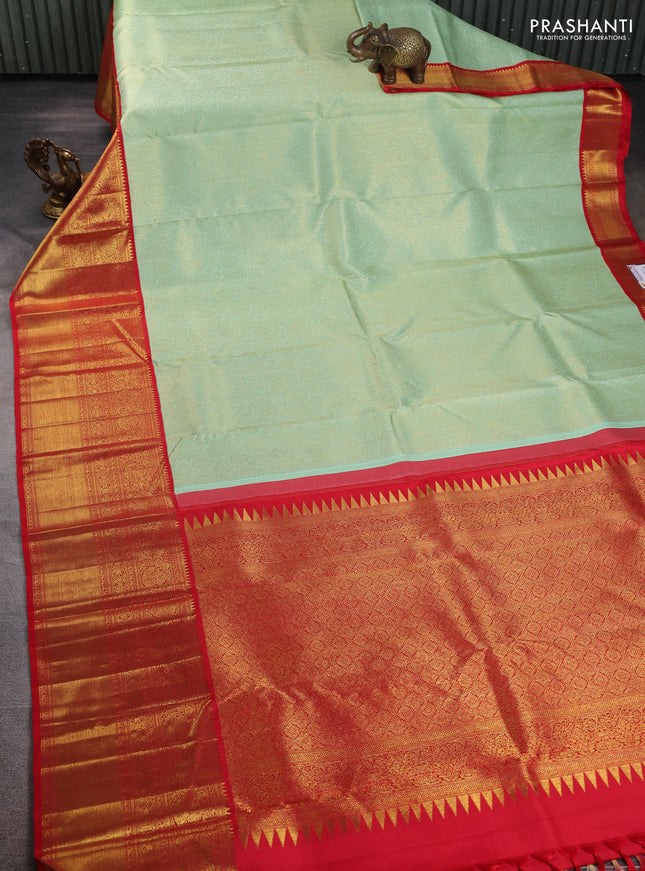 Pure kanchipuram silk saree pastel green and red with allover zari woven brocade weaves and long zari woven border