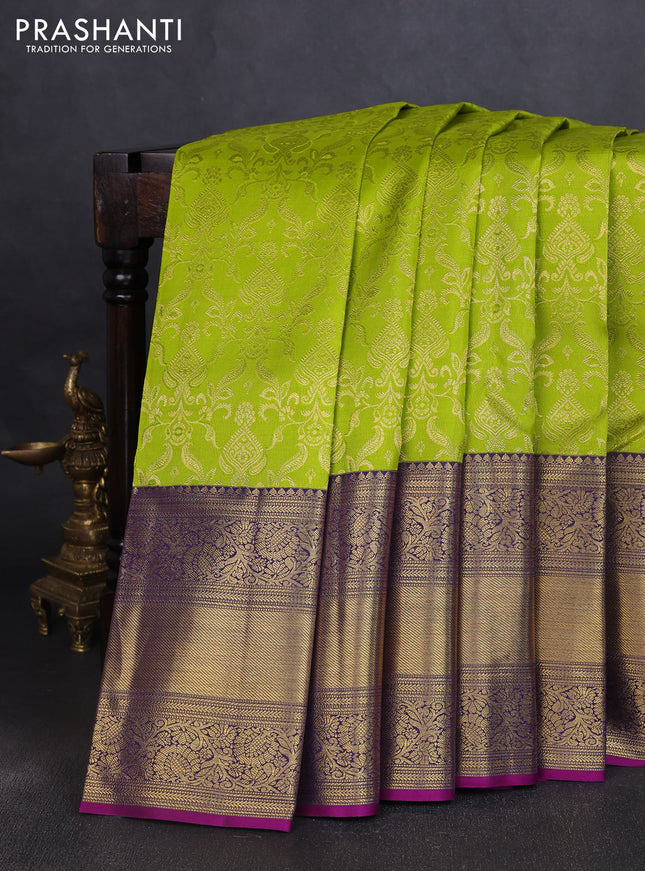 Pure kanchipuram silk saree light green and purple with allover zari woven brocade weaves and long zari woven border