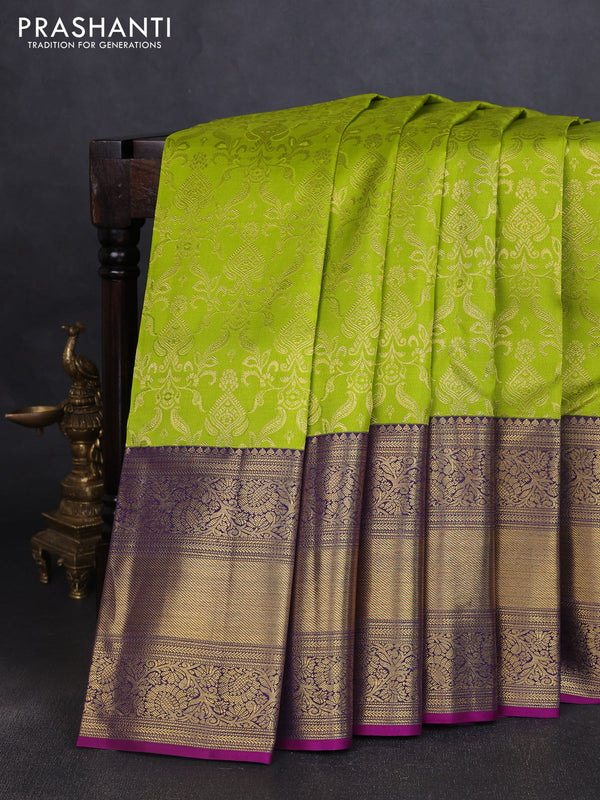 Pure kanchipuram silk saree light green and purple with allover zari woven brocade weaves and long zari woven border