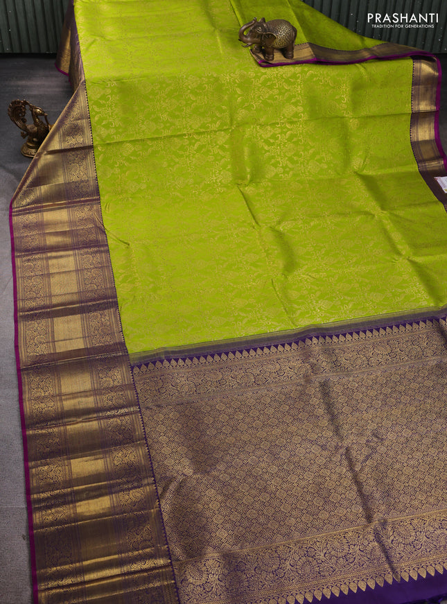 Pure kanchipuram silk saree light green and purple with allover zari woven brocade weaves and long zari woven border