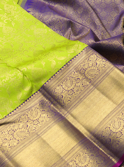 Pure kanchipuram silk saree light green and purple with allover zari woven brocade weaves and long zari woven border