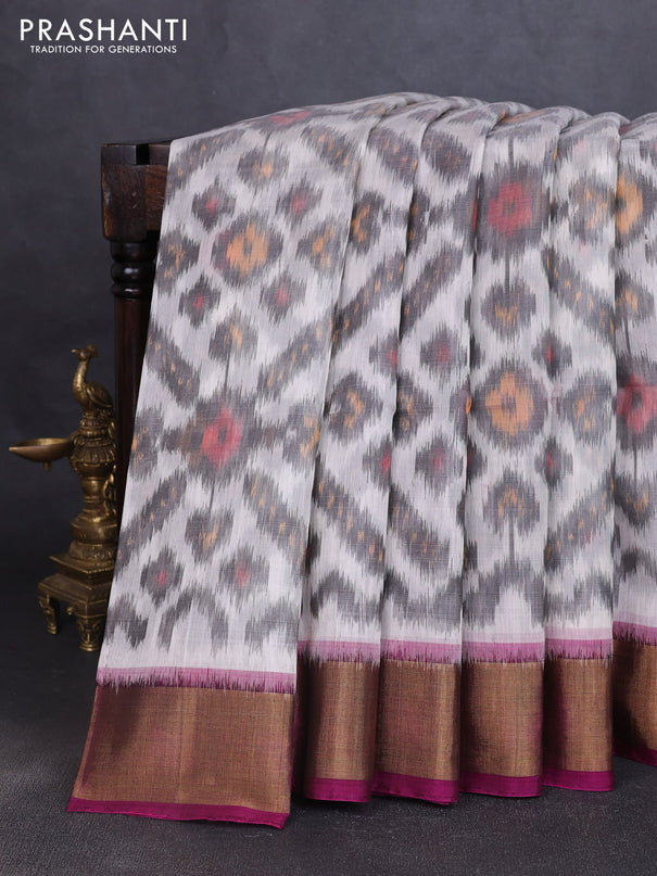 Ikat silk cotton saree off white and purple with allover ikat weaves and zari woven border