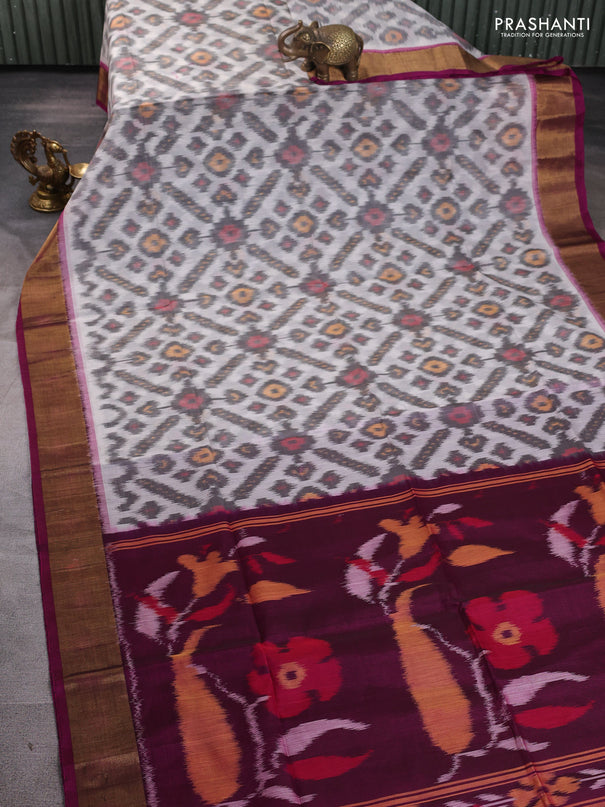Ikat silk cotton saree off white and purple with allover ikat weaves and zari woven border