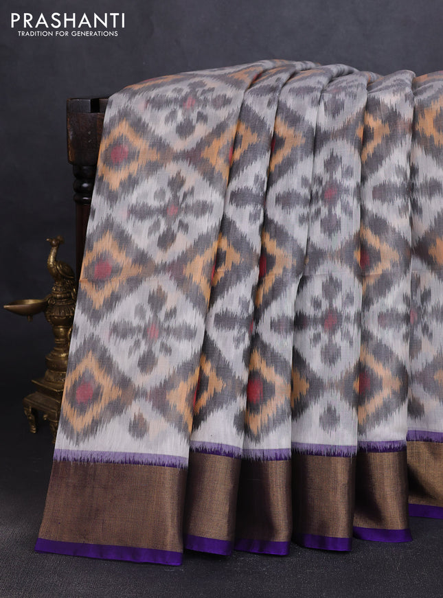 Ikat silk cotton saree off white and violet with allover ikat weaves and zari woven border