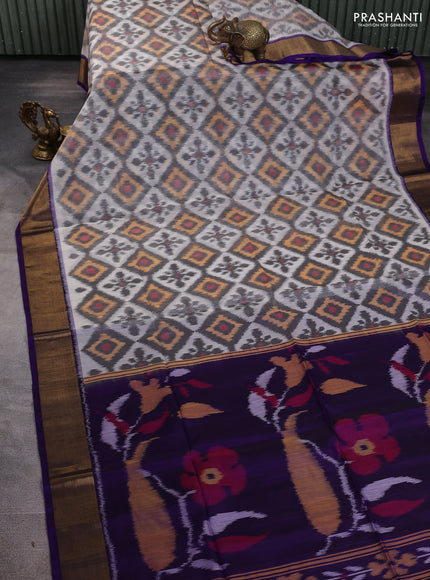 Ikat silk cotton saree off white and violet with allover ikat weaves and zari woven border