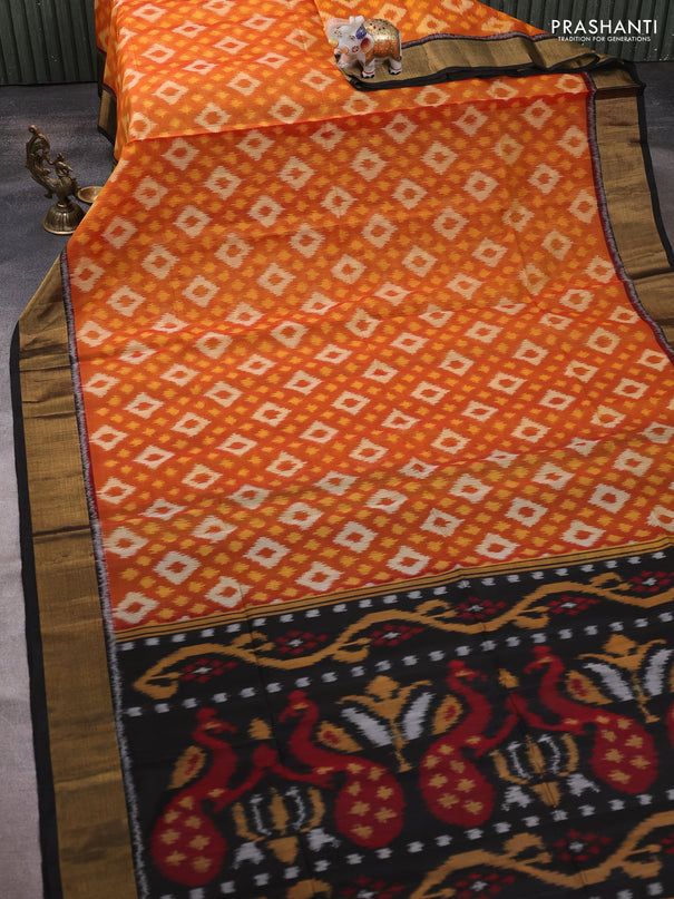 Ikat silk cotton saree rust shade and black with allover ikat weaves and zari woven border