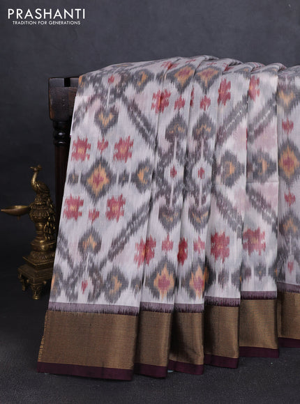Ikat silk cotton saree off white grey and deep coffee brown with allover ikat weaves and zari woven border