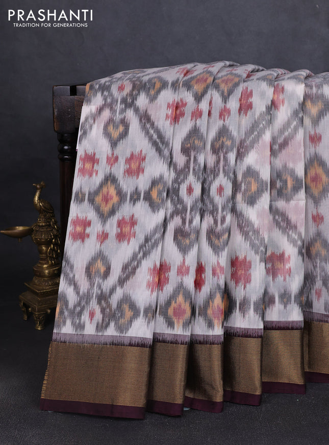 Ikat silk cotton saree off white grey and deep coffee brown with allover ikat weaves and zari woven border