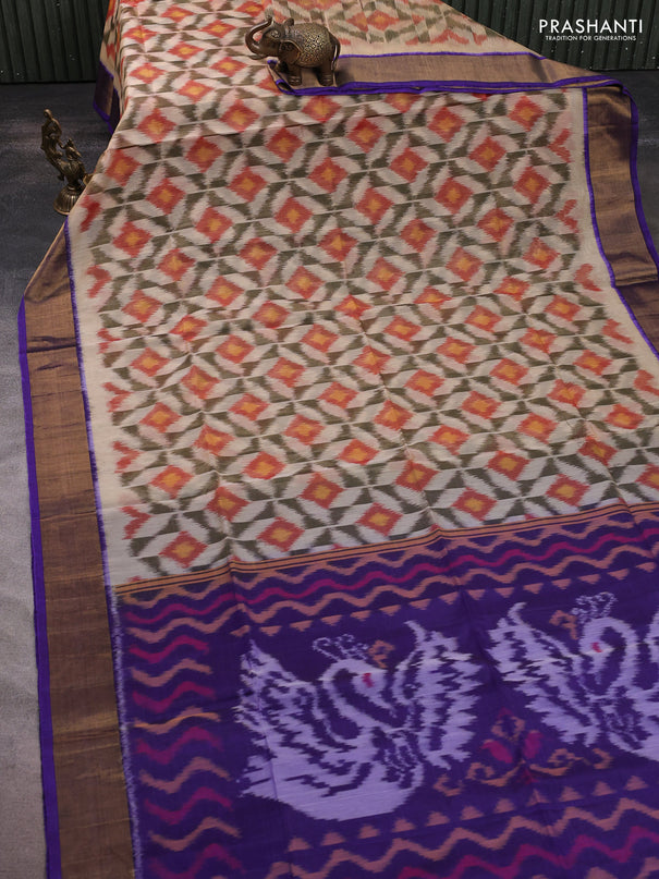 Ikat silk cotton saree cream and blue with allover ikat weaves and zari woven border