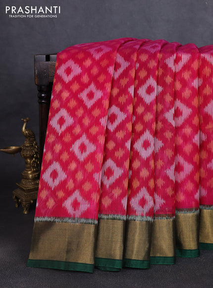 Ikat silk cotton saree pink and bottle green with allover ikat weaves and zari woven border