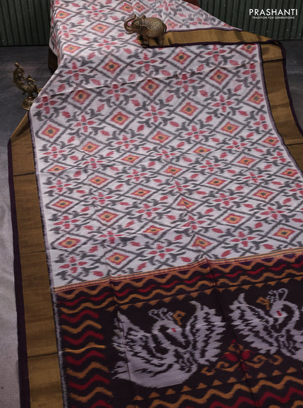 Ikat silk cotton saree off white and wine shade with allover ikat weaves and zari woven border