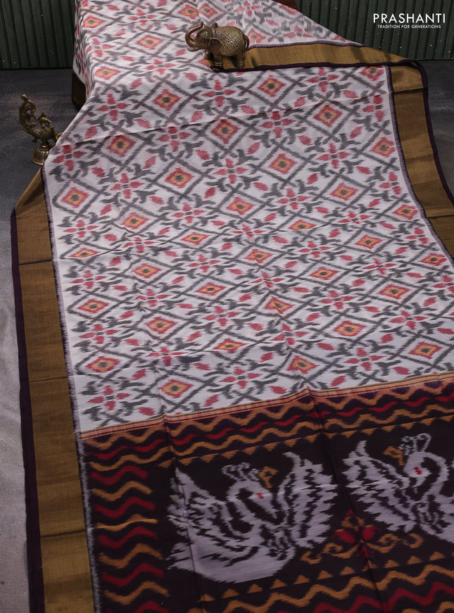 Ikat silk cotton saree off white and wine shade with allover ikat weaves and zari woven border