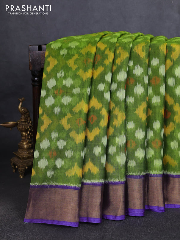 Ikat silk cotton saree green and violet with allover ikat weaves and zari woven border