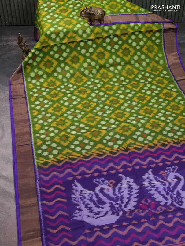 Ikat silk cotton saree green and violet with allover ikat weaves and zari woven border