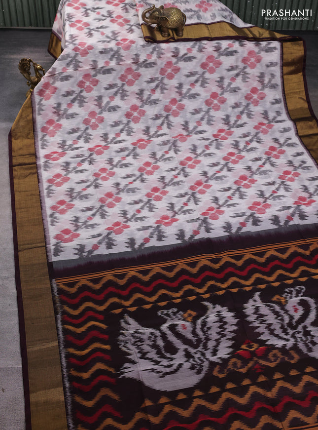 Ikat silk cotton saree off white and coffee brown with allover ikat butta weaves and zari woven border