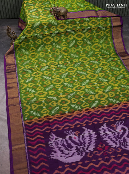 Ikat silk cotton saree green and purple with allover ikat weaves and zari woven border