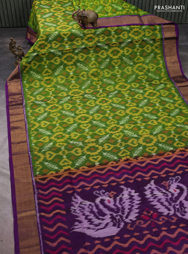Ikat silk cotton saree green and purple with allover ikat weaves and zari woven border