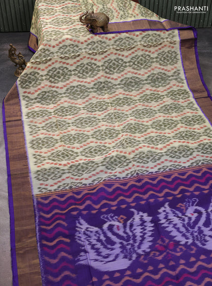 Ikat silk cotton saree cream and blue with allover ikat weaves and zari woven border
