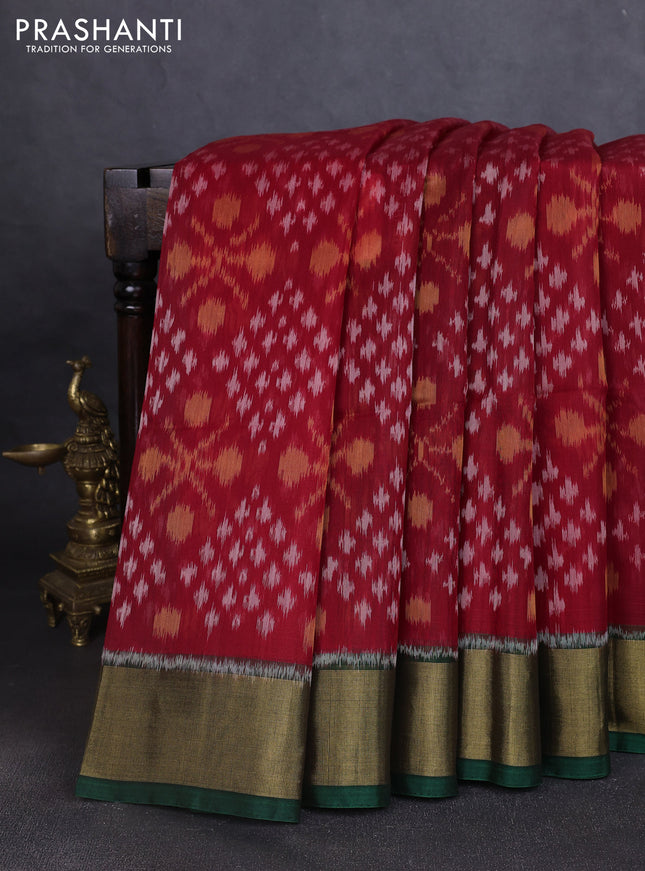 Ikat silk cotton saree red and bottle green with allover ikat weaves and zari woven border