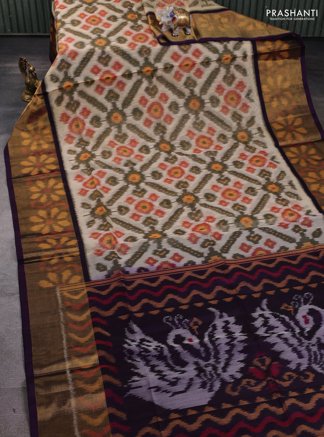 Ikat silk cotton saree peach shade and deep violet with allover ikat weaves and long ikat woven zari border