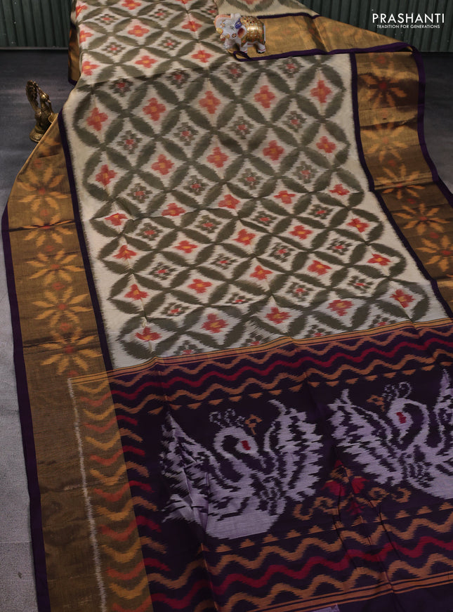 Ikat silk cotton saree mehendi green and deep violet with allover ikat weaves and long ikat woven zari border