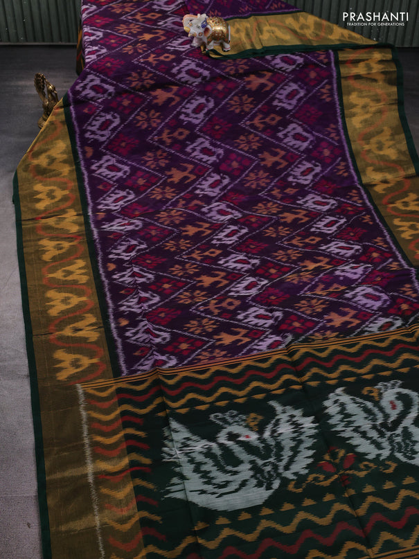 Ikat silk cotton saree deep violet and bottle green with allover ikat weaves and long ikat woven zari border