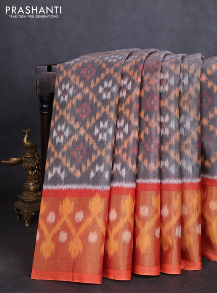 Ikat silk cotton saree grey and orange with allover ikat weaves and long ikat woven zari border